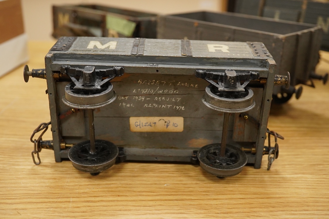 A Gauge One live steam 0-4-0T locomotive in the style of a Bowman model locomotive, with spirit fired with two simple outside oscillating cylinders, together with five LNWR and Midland Railway freight wagons, including a